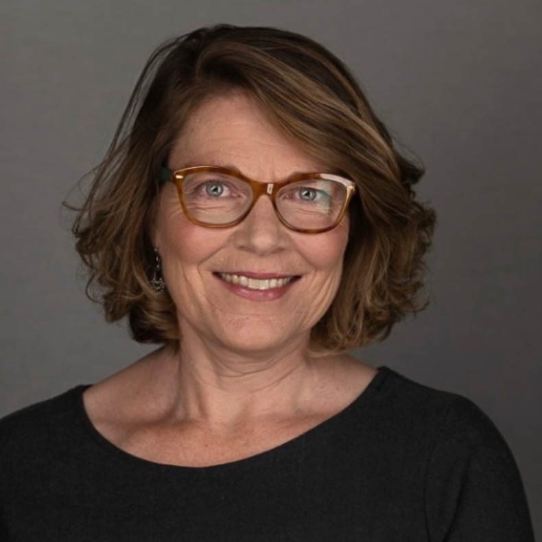 Portrait photo of woman smiling in glasses