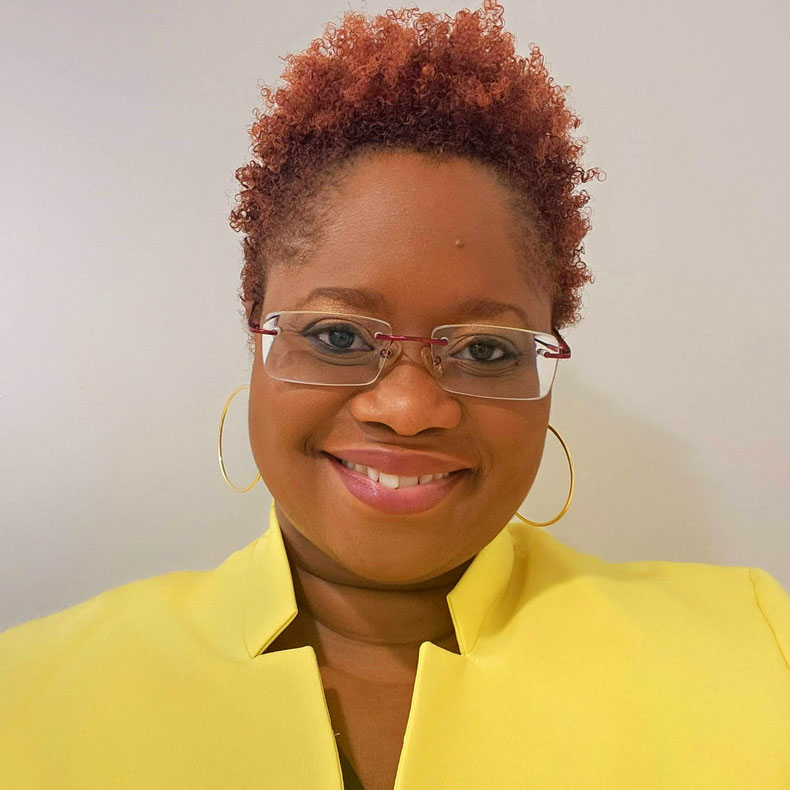 Photo of smiling woman in yellow shirt