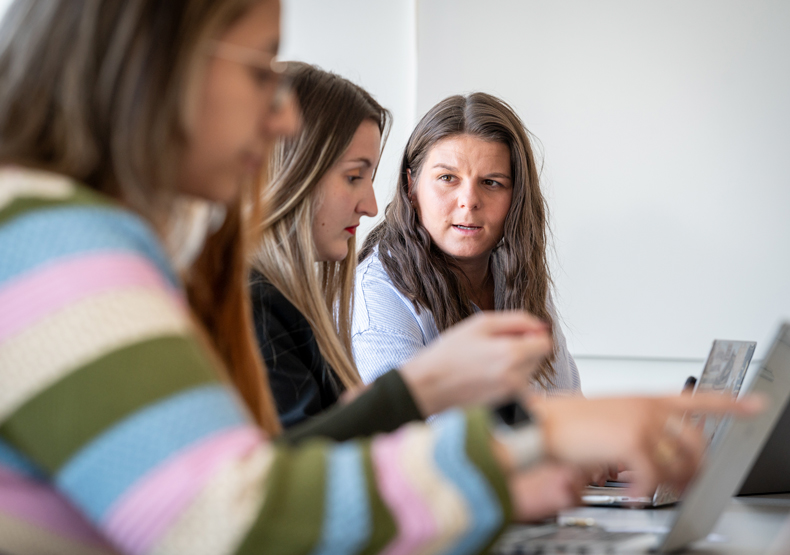 Admissions three women sitting in front of laptops