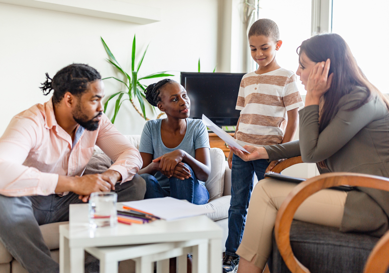 Program Overview Couple with son talking to a counselor
