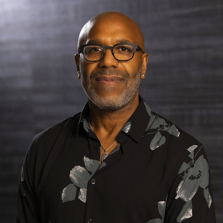Portrait photo of black man in dark shirt