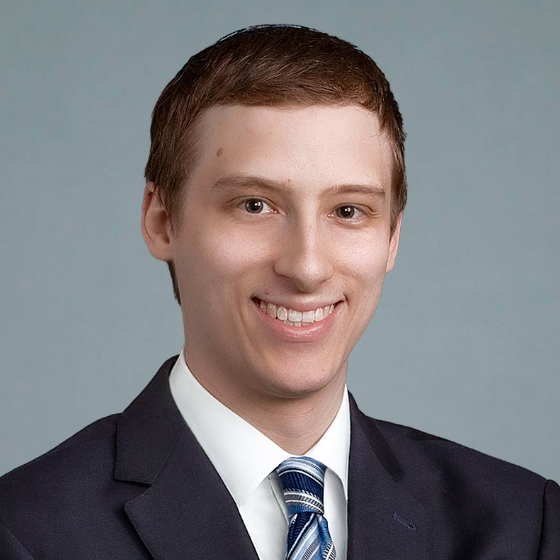 portrait photo of young man in suite and tie