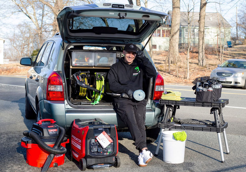 Anthony Santoro with his car and tools