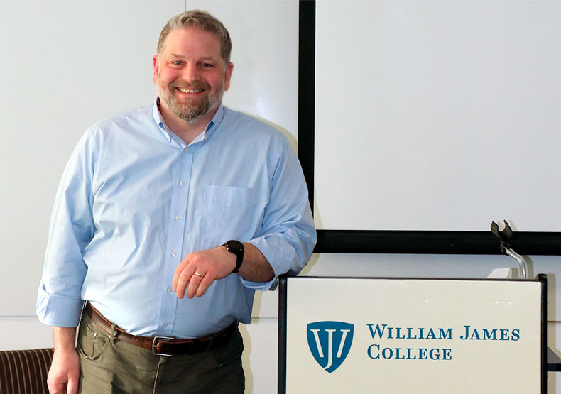 man standing at podium