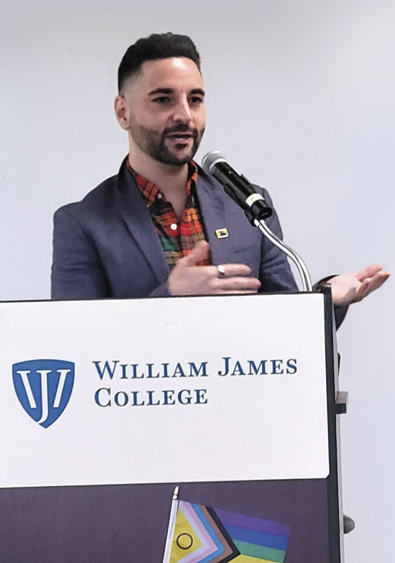 man speaking at podium