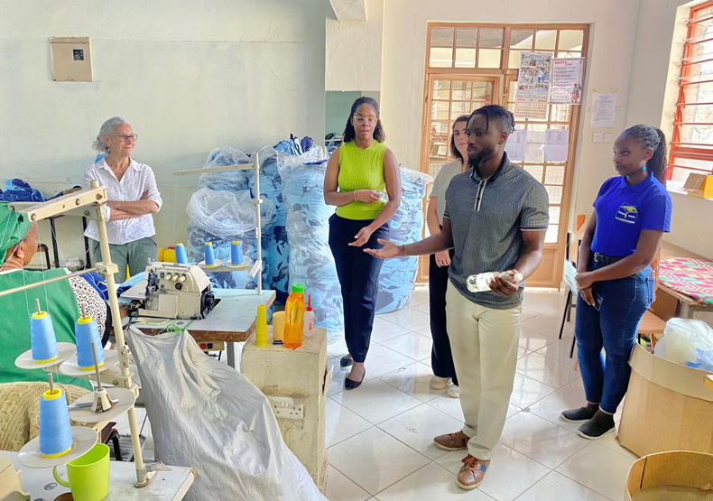 five people at a factory