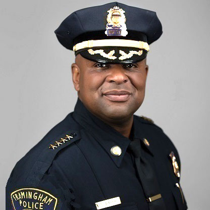 Black man in a police uniform posing for camera