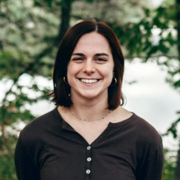 Close up portrait photo of Nevalee Hawkins with trees in background